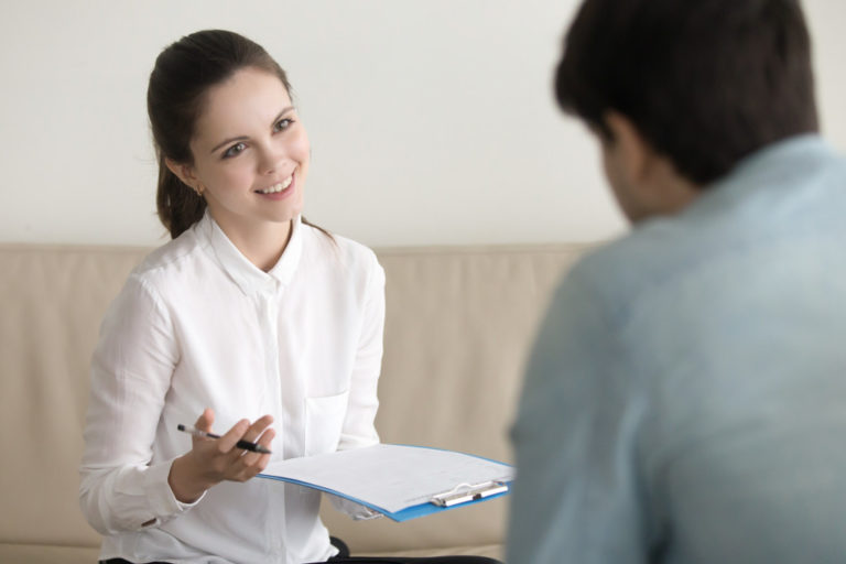 A woman interviewing an applicant