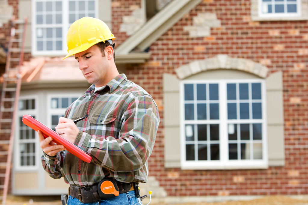 contractors monitoring home renovation