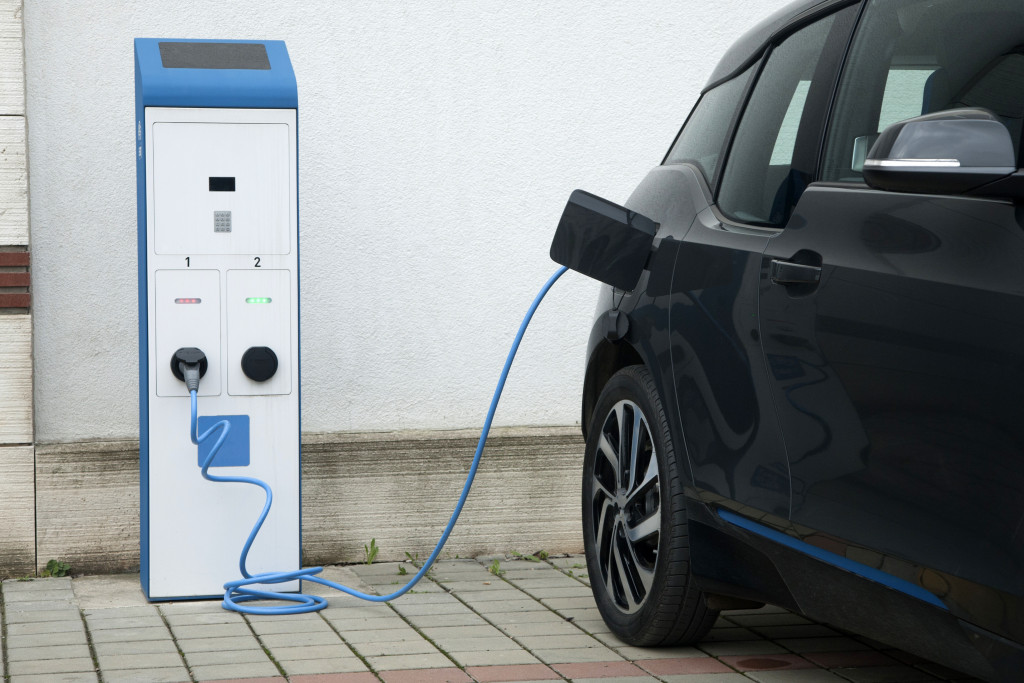 black Electric car charging on a port