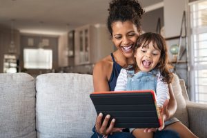 mom and daughter using tablet