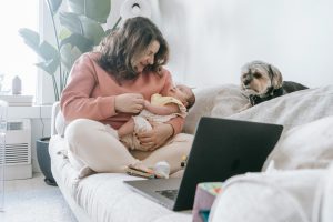 watching tv with newborn in the room